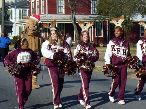 High School Cheerleaders Marching in Parade